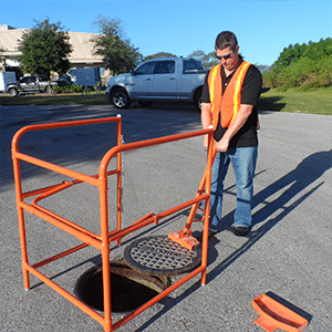 A barrier for safe manhole lifting